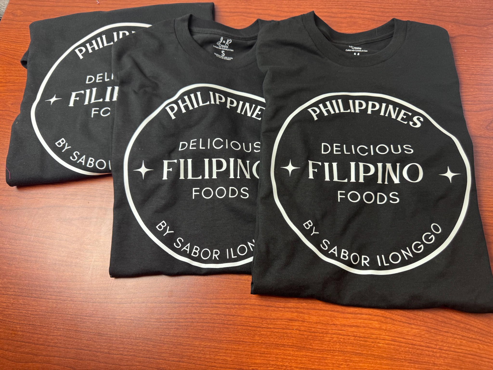 Custom branded business uniform shirts for Filipino Foods restaurant